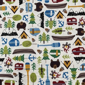 634 COTTON fabric white background with camping gear & forest trees sold by the yard.