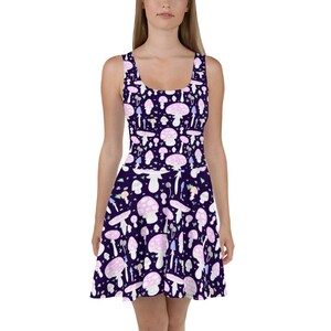 May include: A purple skater dress with a pattern of pink and white mushrooms on a dark purple background.