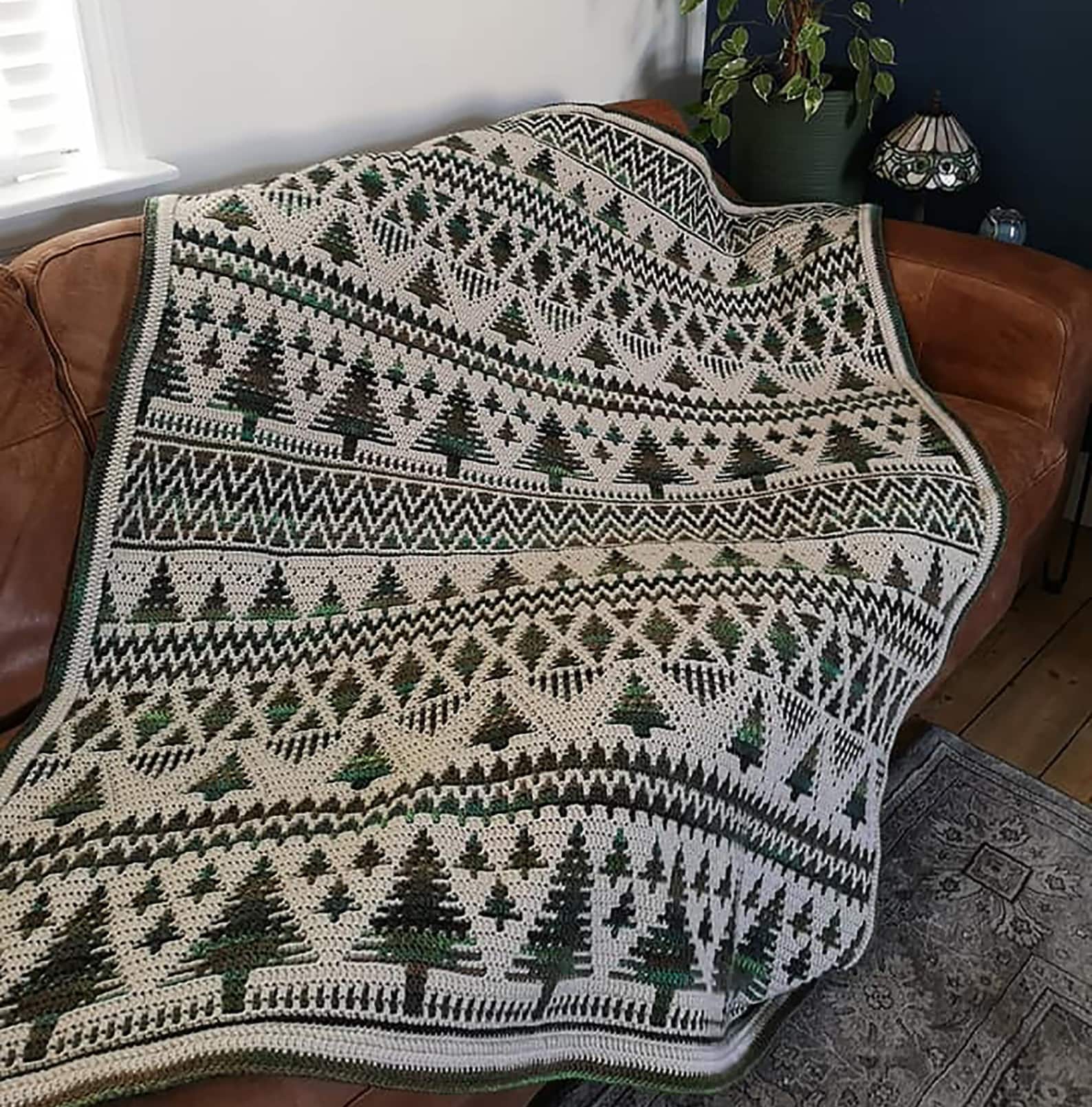 Sholach overlay mosaic crochet afghan with trees and geometric winter patterns