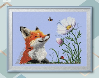 May include: A cross-stitch pattern depicting a smiling fox with orange and white fur, sitting in a field of green grass and white flowers. A bee flies above the fox and a ladybug is on a leaf.