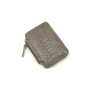 May include: A brown leather wallet with a snakeskin pattern and a zipper closure.