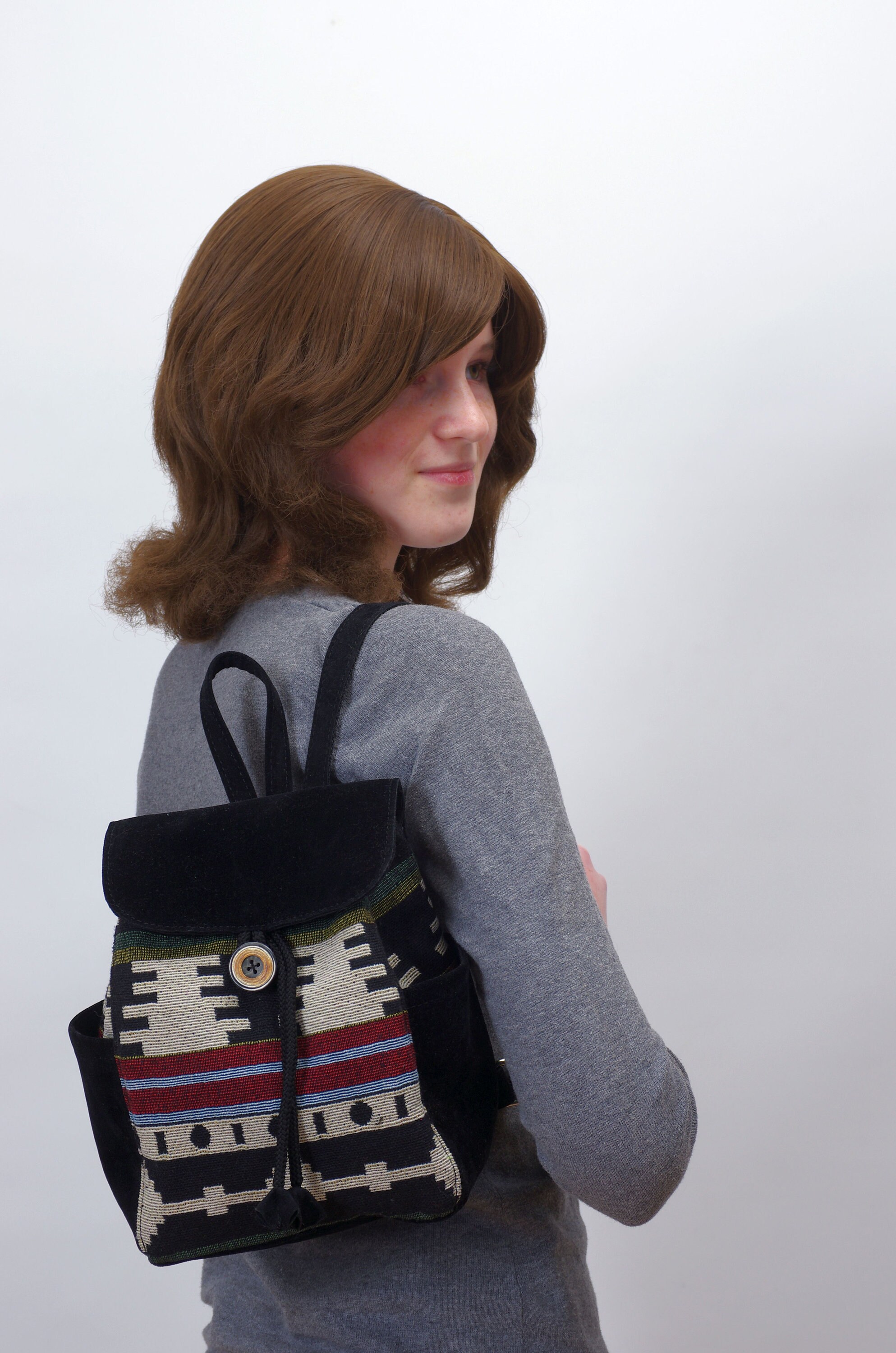 small black canvas backpack