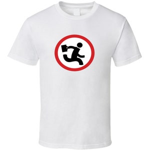 May include: White t-shirt with a red circle and a black stick figure running with a briefcase. The text "No" is inside the circle.
