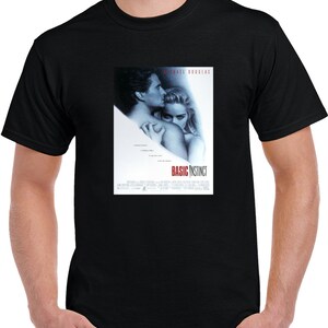 May include: Black t-shirt with a movie poster print of the film "Basic Instinct" featuring Michael Douglas and Sharon Stone.