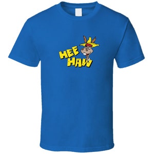 May include: A royal blue t-shirt with a cartoon donkey wearing a yellow hat and the words "Hee Haw" in yellow letters.