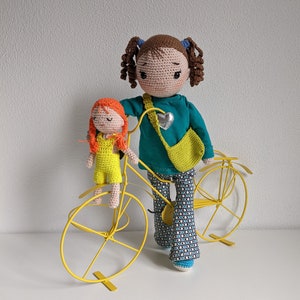 Cute girl doll with clothes and a small doll. image 1