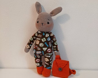 Sweet, crocheted cuddly toy rabbit with 3 sets of clothes.