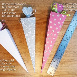 May include: Three paper cones with different patterns and colors. The cones are decorated with hearts and ribbons. The cones are 12 inches tall and are made from 12 inch by 12 inch paper. The cones are cut from A4 paper.
