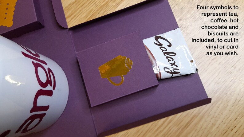 May include: A purple box with a white mug that says "Galaxy" on it. The box also has a chocolate bar and a gold cup icon.