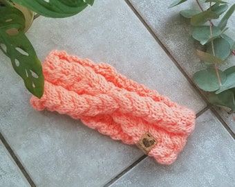 La Frileuse: Neon peach winter headband in hand-braided knit