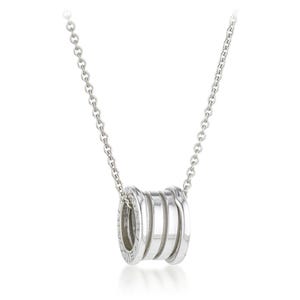 May include: A silver necklace featuring a pendant with three stacked, ridged bands. The pendant is connected to a delicate chain. The design is simple and elegant, suitable for everyday wear or special occasions.