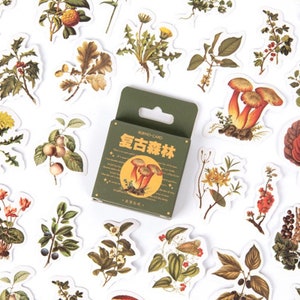 May include: A sheet of vintage-style stickers featuring illustrations of mushrooms, flowers, and plants. The stickers are in a green box with the text "WUYUO-CARD  童古森林" in Chinese characters.