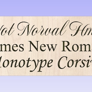 May include: A close-up of a wooden sign with the text "Not Normal Hmk" in a cursive font. The text "Times New Roman" and "Monotype Corsiva" are also visible below the first line of text.