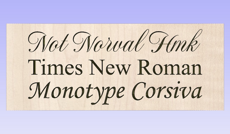 May include: A close-up of a wooden sign with the text "Not Normal Hmk" in a cursive font. The text "Times New Roman" and "Monotype Corsiva" are also visible below the first line of text.