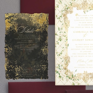 May include: Elegant wedding invitation suite featuring a black and gold details card and a cream-colored invitation with floral accents. The suite includes burgundy envelopes, perfect for a formal event.