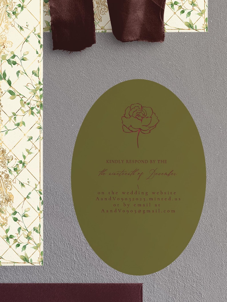 May include: An olive green oval card with a rose illustration and text. The card is set against a textured gray background, with a patterned floral design on the left and a dark burgundy ribbon at the top.