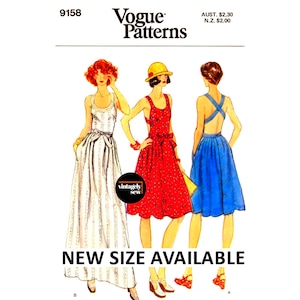 May include: A vintage Vogue sewing pattern for three dresses. The pattern is for a sleeveless white dress, a red dress with a white polka dot pattern, and a blue dress with a criss-cross back. The pattern number is 9158.