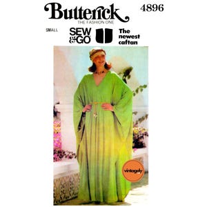 May include: Vintage sewing pattern for a caftan, Butterick pattern number 4896, featuring a woman wearing a green caftan with a belt and a headscarf. The pattern is labelled "The newest caftan" and "Sew & Go".