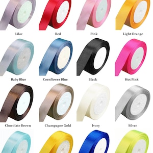 May include: A collection of 16 spools of satin ribbon in various colors, including lilac, red, pink, light orange, baby blue, cornflower blue, black, hot pink, chocolate brown, champagne gold, ivory, silver, sky blue, yellow, royal blue, and light green.