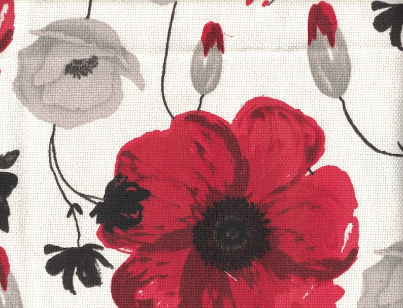 May include: A white fabric with a red and gray floral pattern. The flowers are stylized and have a painterly look. The background is white.