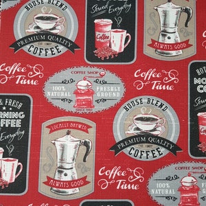 May include: Red fabric with a repeating pattern of vintage coffee shop signs. The signs feature illustrations of coffee pots, coffee cups, and coffee grinders. The text on the signs includes "Coffee Time", "House Blend", "Premium Quality Coffee", "Hot & Fresh Morning Coffee", "Locally Brewed", "Always Good", "Coffee Shop", "100% Natural", "Freshly Ground", and "Since 1950".
