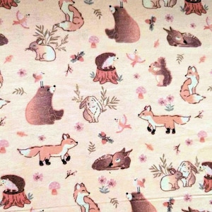 Tela de franela de algodón con animales del bosque en rosa ruborizado: material suave para colcha de bebé