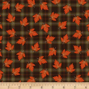 May include: Autumn-themed fabric featuring a plaid pattern in shades of brown, green, and red. Scattered across the plaid are orange maple leaves. A wooden ruler with inch markings is at the bottom.