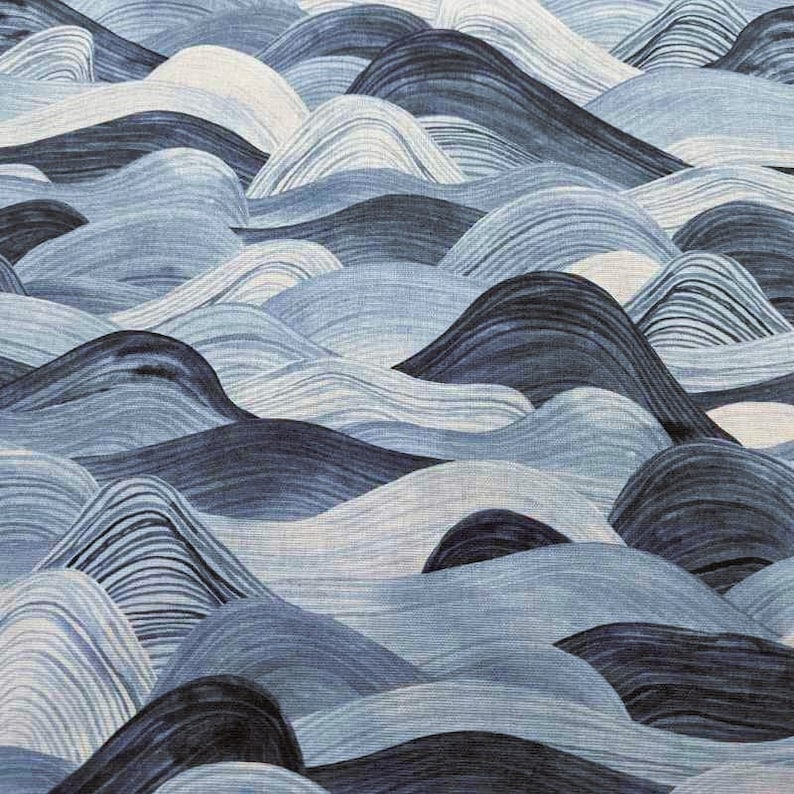 May include: Abstract textile pattern featuring a repeating wave design in shades of blue and white. The fabric has a textured appearance, with the waves created by curved lines. The overall effect is a calming, ocean-inspired aesthetic.