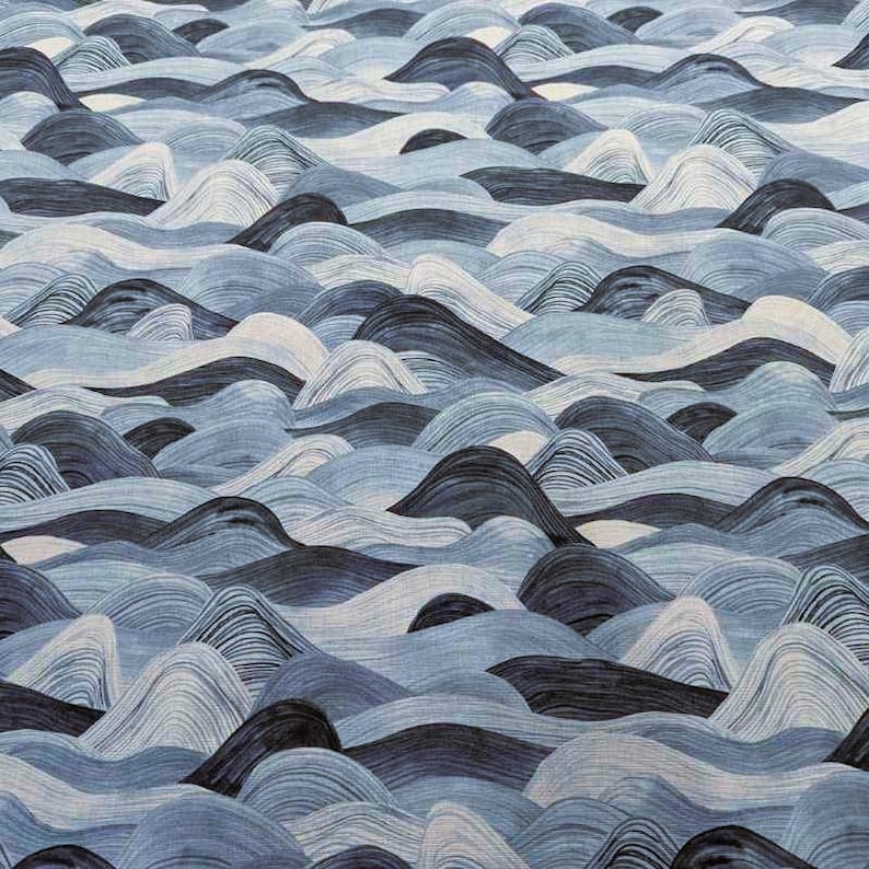 May include: Abstract textile pattern featuring a repeating design of stylized waves. The waves are rendered in shades of blue, from light to dark, creating a textured, undulating surface. The overall effect is reminiscent of a watercolor painting.