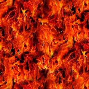 May include: A seamless pattern of flames in shades of red, orange, and yellow. The fiery design features dynamic, swirling shapes, creating a sense of movement and heat. The overall effect is a vibrant and energetic representation of fire.