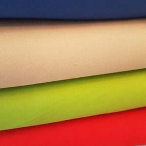 May include: Four fabric swatches stacked on top of each other. The top swatch is blue, the second is beige, the third is green, and the bottom swatch is red.