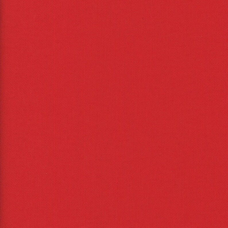 May include: A solid red fabric swatch. The fabric has a smooth, even texture.