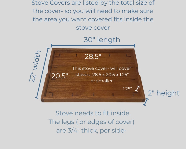 May include: A wooden stove cover measuring 28.5 inches by 20.5 inches by 1.25 inches. The cover is made of natural wood and has a light brown colour. The text on the cover reads: "This stove cover - will cover stoves - 28.5 x 20.5 x 1.25" or smaller."