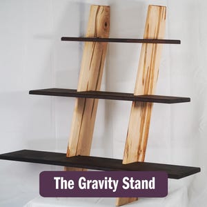 Gravity stand wall shelf sitting against a white backdrop.