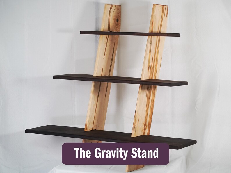 Gravity stand wall shelf sitting against a white backdrop.