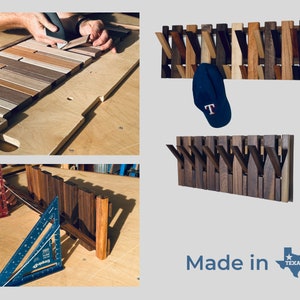 May include: A wooden coat rack with multiple hooks made from different types of wood. The rack is mounted on a wall and has a baseball cap hanging from one of the hooks. The text "Made in Texas" is visible below the rack.
