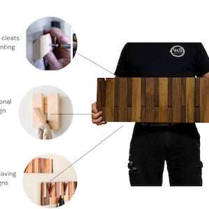 May include: A wooden wall-mounted coat rack with multiple hooks. The rack is made of natural wood with a light brown finish. The rack is shown being installed with french cleats. The rack is also shown being held by a person, demonstrating its size and functionality. The rack is a space-saving design that can be used in a variety of settings.