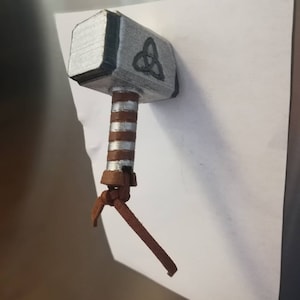 Thor Mjölnir Hammer fridge Magnet and The  Stormbreaker fridge magnet. Can purchase either one or both.