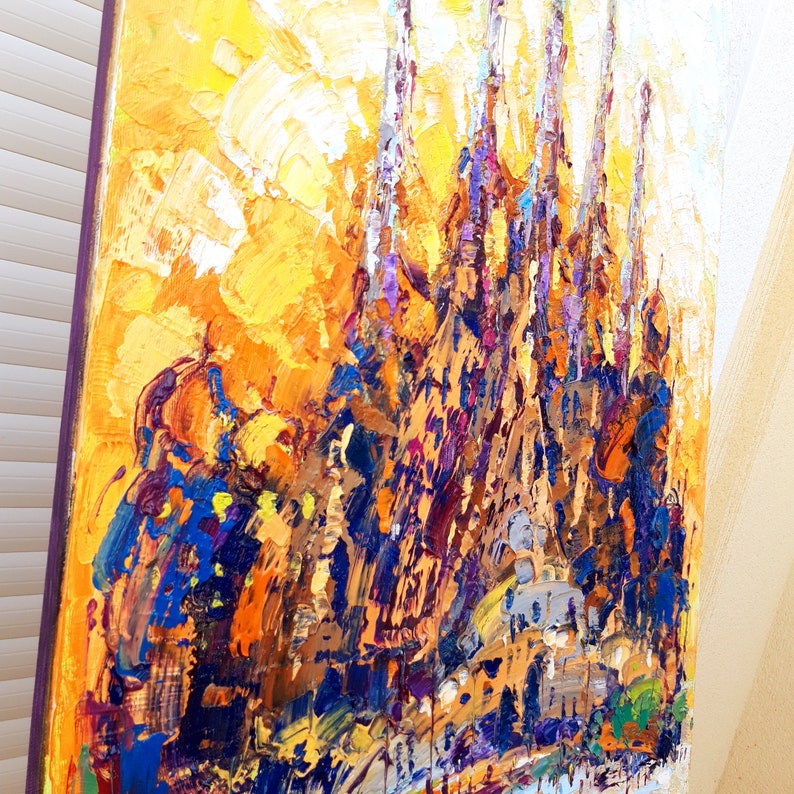May include: Abstract oil painting of a cityscape with tall buildings in shades of yellow, orange, purple, and blue.