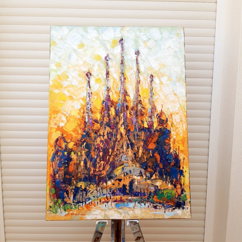 May include: A colourful oil painting of a famous cathedral with multiple spires. The painting is done in a textured style with thick brushstrokes. The background is a bright yellow and orange.