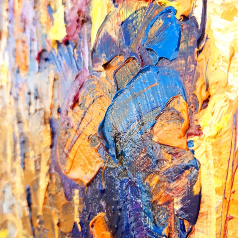 May include: Abstract painting with thick brushstrokes in shades of blue, orange, and yellow. The paint is applied in a textured, layered style, creating a dynamic and expressive composition.