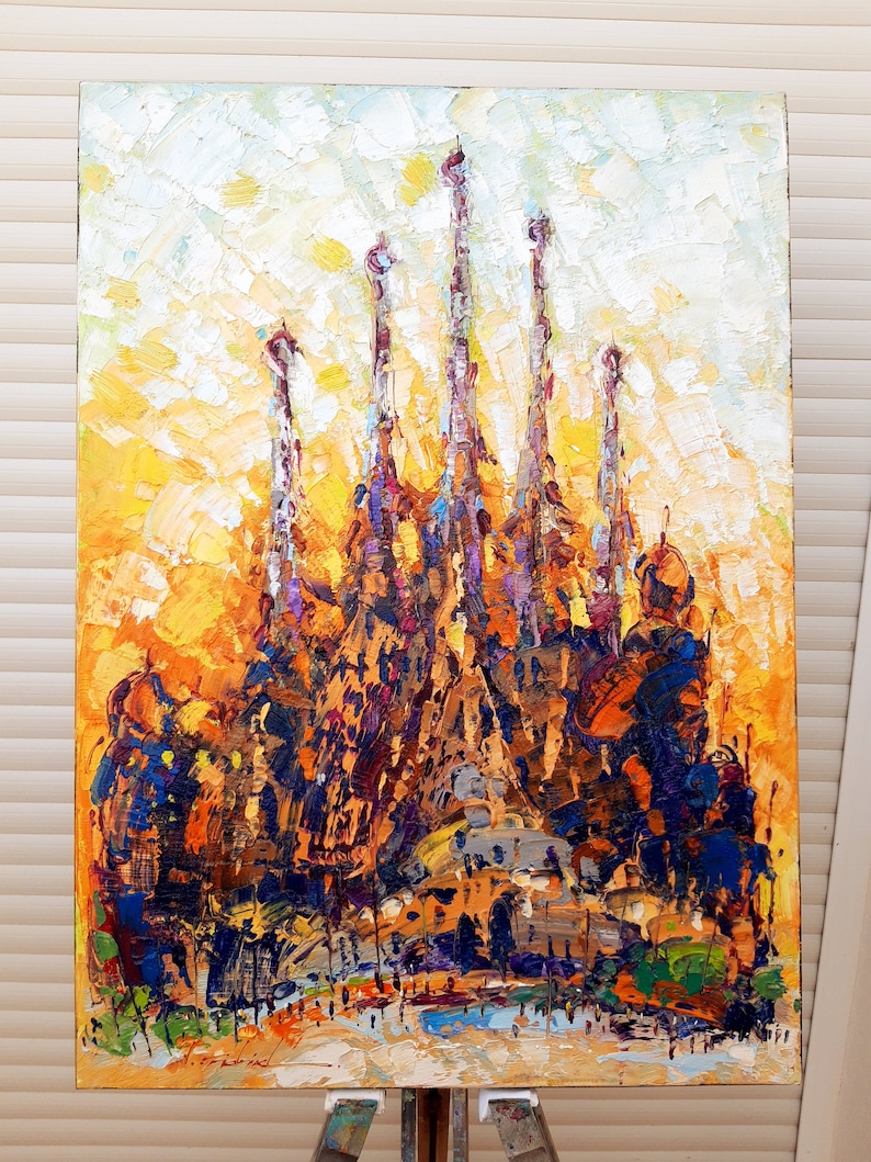 May include: A colourful, abstract painting of a famous cathedral with multiple spires. The painting is done in a thick, impasto style with visible brushstrokes. The colours are mostly warm, with shades of yellow, orange, brown, and purple.