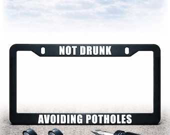 Funny License Plate Frame - Install Kit Included - Plastic, Metal, or Carbon Fiber - UV Printed Text - Avoiding Potholes