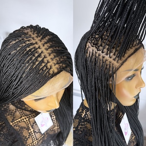 May include: Black braided wig with a lace front. The wig is styled in small braids and is long and straight.