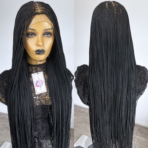 May include: Black braided wig with long, straight strands. The wig is made with a lace front and is styled in a micro braid pattern.