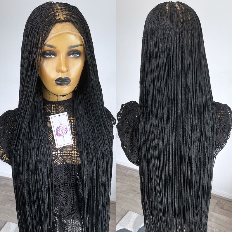 May include: Black braided wig with long, straight strands. The wig is made with a lace front and is styled in a micro braid pattern.