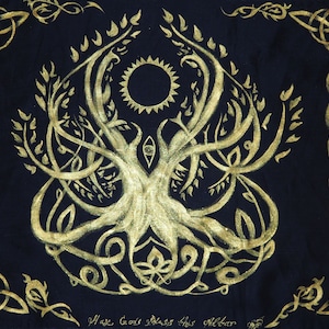 May include: A gold Celtic tree of life design on a black fabric background. The tree has a sun and an eye in the centre. The text "May Gods Bless This Altar" is written at the bottom.