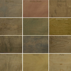 May include: A wood stain color chart with 20 different wood stain colors. The colors are arranged in a grid of four rows and five columns. The colors include Oak, Sky Grey, Winter Blush, Mud Light, Oyster, Emerald, Walnut, Blonde, Smoked Oak, Bourbon, Cinnamon Brown, Night Grey, Coal Beige, Castle Brown, Titanium Grey, Dark Oak, Biscuit, Vanilla, Pure, and Mist.