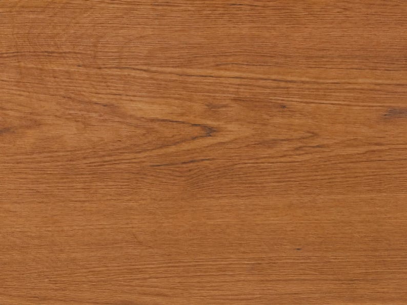 May include: A flat, rectangular surface featuring a warm, medium-brown wood grain pattern. The texture displays horizontal, organic lines and natural variations in color, characteristic of finished timber with a smooth, consistent appearance.
