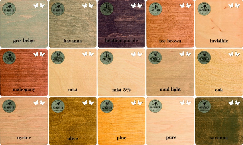 May include: A selection of wooden colour swatches, each labelled with a unique name. Colours vary from light beige to dark brown, including shades like "havanna", "heather purple", and "ice brown". Each swatch has a logo and butterfly cutouts.